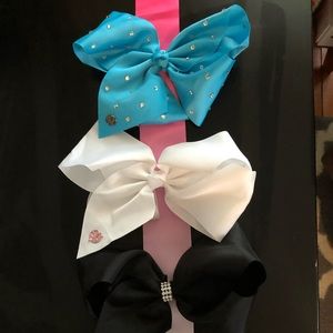 Three JoJo Siwa bows with hanger.